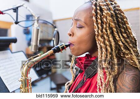 African American saxophone player recording in studio View Large Photo Image Stock Photo - African American saxophone player recording in studio. Fotosearch