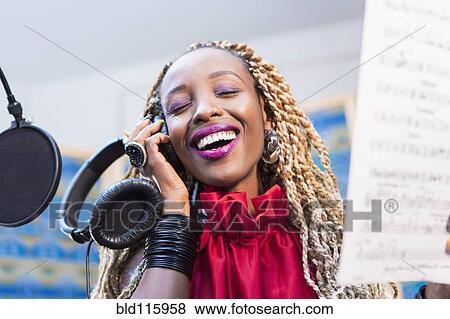 African American singer recording in studio View Large Photo Image Stock Photo - African American singer recording in studio. Fotosearch