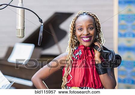 African American singer smiling in studio View Large Photo Image Stock Photo - African American singer smiling in studio. Fotosearch
