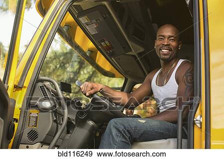 Black man smiling in truck View Large Photo Image Stock Photo - Black man smiling in truck. Fotosearch
