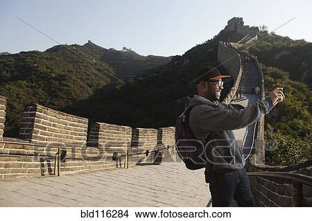 Black man taking picture on Great Wall of China, Beijing, Beijing, China View Large Photo Image Picture - Black man taking picture on Great Wall of China, Beijing, Beijing, China. Fotosearch