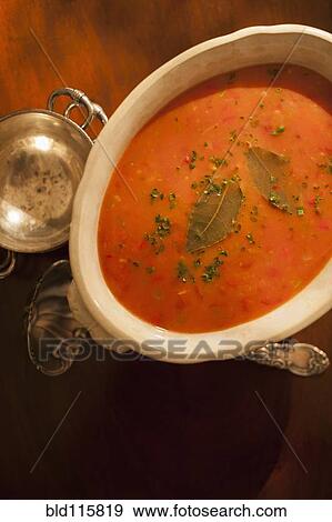 Stock Photo - Bowl of soup on table. Fotosearch