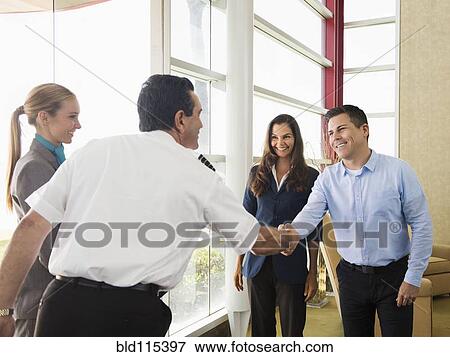 Business people and pilot shaking hands View Large Photo Image Stock Photo - Business people and pilot shaking hands. Fotosearch