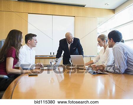 Business people talking in meeting View Large Photo Image Stock Image - Business people talking in meeting. Fotosearch