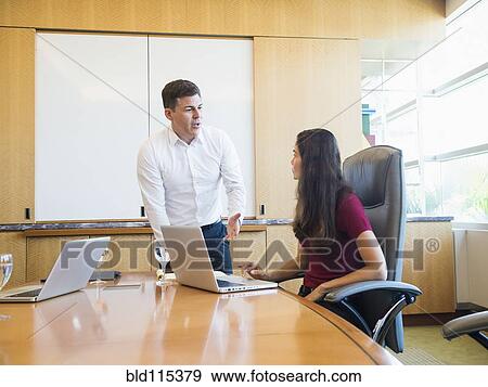 Business people talking in meeting View Large Photo Image Stock Photo - Business people talking in meeting. Fotosearch