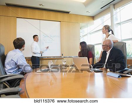 Business people talking in meeting View Large Photo Image Stock Photograph - Business people talking in meeting. Fotosearch