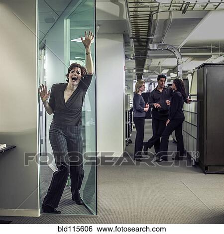 Stock Photograph - Businesswoman shouting in office. Fotosearch