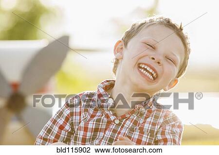 Stock Image - Caucasian boy smiling. Fotosearch
