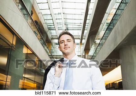 Stock Image - Caucasian businessman in office. Fotosearch