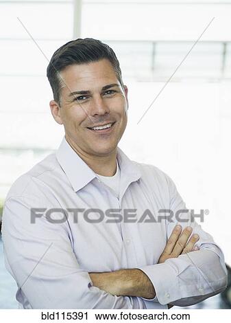 Caucasian businessman smiling View Large Photo Image Stock Image - Caucasian businessman smiling. Fotosearch