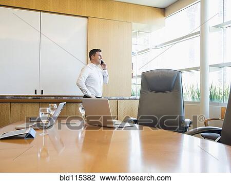 Caucasian businessman talking on cell phone View Large Photo Image Stock Image - Caucasian businessman talking on cell phone. Fotosearch