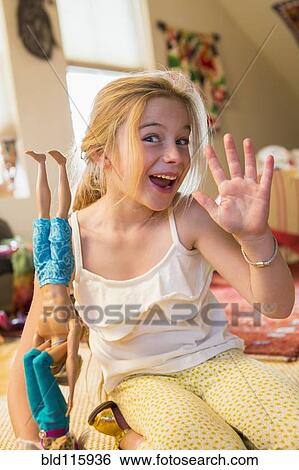 Caucasian girl playing with dolls View Large Photo Image Stock Photograph - Caucasian girl playing with dolls. Fotosearch