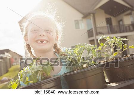 Stock Image - Caucasian girl showing gap tooth. Fotosearch