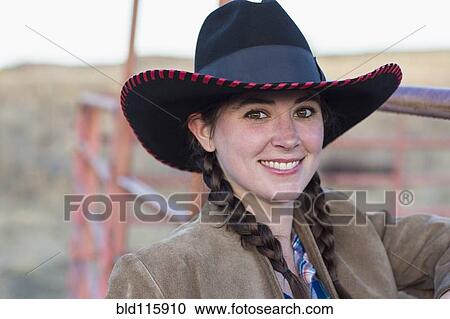 Stock Image - Caucasian girl smiling on farm. Fotosearch