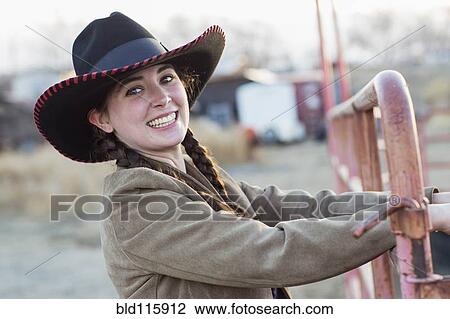 Stock Image - Caucasian girl smiling on farm. Fotosearch