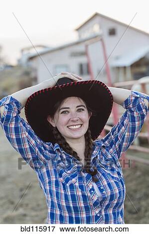 Stock Photo - Caucasian girl smiling on farm. Fotosearch