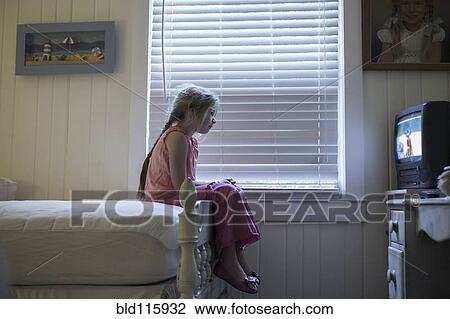 Caucasian girl watching television on bed View Large Photo Image Stock Image - Caucasian girl watching television on bed. Fotosearch