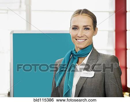 Caucasian hostess smiling View Large Photo Image Stock Photograph - Caucasian hostess smiling. Fotosearch