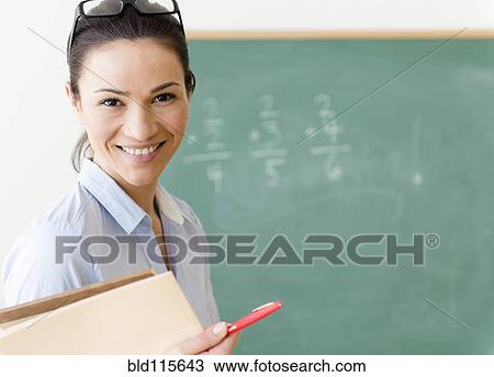 Caucasian teacher smiling in classroom View Large Photo Image Stock Image - Caucasian teacher smiling in classroom. Fotosearch