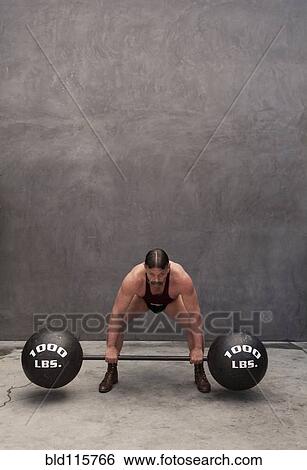 Caucasian weight lifter straining View Large Photo Image Stock Photograph - Caucasian weight lifter straining. Fotosearch