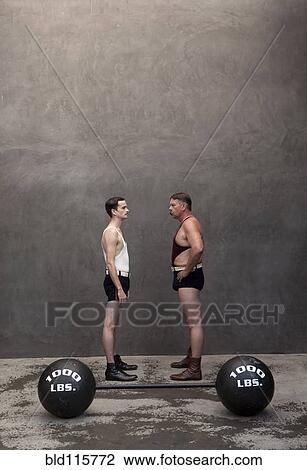 Caucasian weight lifters examining each other View Large Photo Image Stock Image - Caucasian weight lifters examining each other. Fotosearch