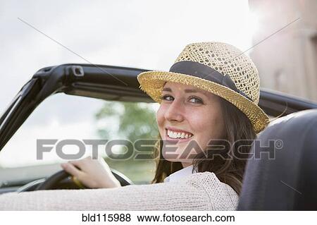 Stock Photo - Caucasian woman driving convertible. Fotosearch