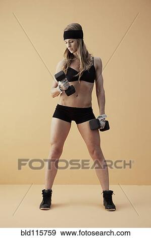 Caucasian woman lifting weights View Large Photo Image Stock Photo - Caucasian woman lifting weights. Fotosearch