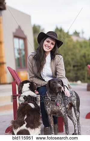 Caucasian woman petting dogs outdoors View Large Photo Image Stock Image - Caucasian woman petting dogs outdoors. Fotosearch