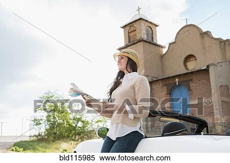 Caucasian woman reading map by church View Large Photo Image Stock Photography - Caucasian woman reading map by church. Fotosearch