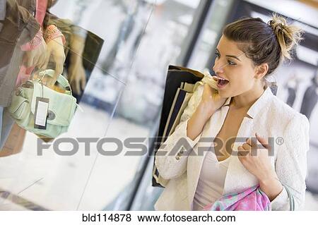 Caucasian woman shopping in mall View Large Photo Image Stock Photo - Caucasian woman shopping in mall. Fotosearch