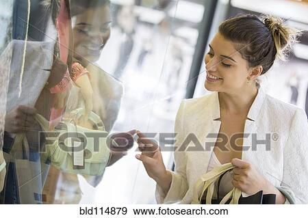 Caucasian woman shopping in mall View Large Photo Image Stock Photo - Caucasian woman shopping in mall. Fotosearch