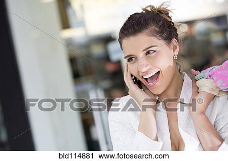 Caucasian woman talking on cell phone View Large Photo Image Stock Image - Caucasian woman talking on cell phone. Fotosearch