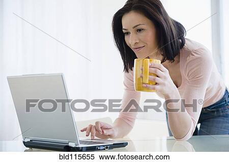 Caucasian woman using laptop View Large Photo Image Stock Photography - Caucasian woman using laptop. Fotosearch