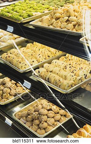 Stock Image - Close up of food in deli case. Fotosearch
