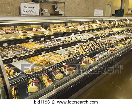 Stock Image - Close up of food in deli case. Fotosearch