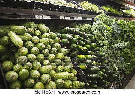 Stock Image - Close up of produce for sale in grocery store. Fotosearch