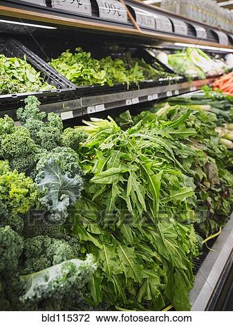 Stock Image - Close up of produce for sale in grocery store. Fotosearch