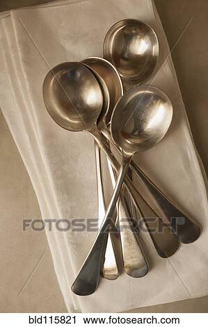 Stock Image - Close up of spoons and napkins. Fotosearch