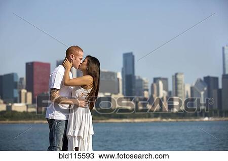 Couple kissing by Chicago skyline, Illinois, USA View Large Photo Image Stock Image - Couple kissing by Chicago skyline, Illinois, USA. Fotosearch