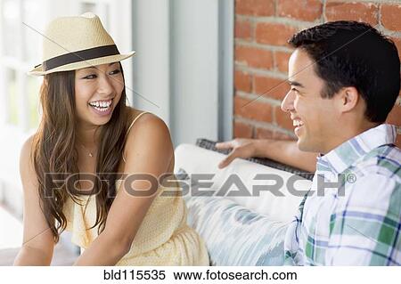 Couple laughing on porch View Large Photo Image Stock Photography - Couple laughing on porch. Fotosearch