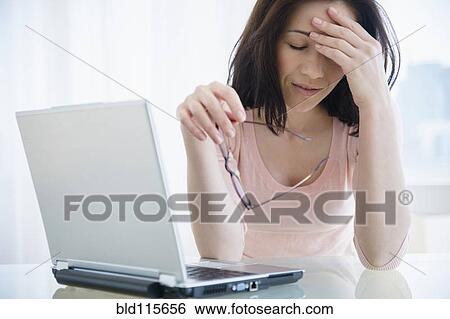 Frustrated Caucasian woman using laptop View Large Photo Image Stock Photograph - Frustrated Caucasian woman using laptop. Fotosearch
