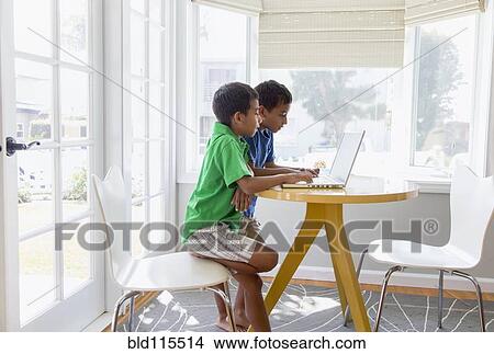 Hispanic boys using laptop View Large Photo Image Picture - Hispanic boys using laptop. Fotosearch