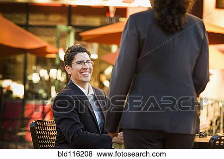 Hispanic business people working at cafe View Large Photo Image Stock Photo - Hispanic business people working at cafe. Fotosearch