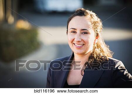 Hispanic businesswoman smiling outdoors View Large Photo Image Stock Photograph - Hispanic businesswoman smiling outdoors. Fotosearch