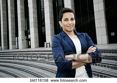 Hispanic businesswoman standing on steps View Large Photo Image Stock Photo - Hispanic businesswoman standing on steps. Fotosearch