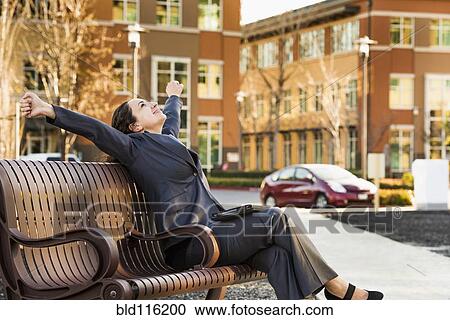 Hispanic businesswoman stretching outdoors View Large Photo Image Stock Image - Hispanic businesswoman stretching outdoors. Fotosearch