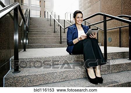 Hispanic businesswoman using tablet computer View Large Photo Image Stock Image - Hispanic businesswoman using tablet computer. Fotosearch