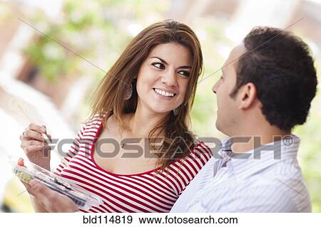Hispanic couple eating sushi together View Large Photo Image Stock Photo - Hispanic couple eating sushi together. Fotosearch