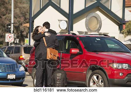 Hispanic couple hugging in parking lot View Large Photo Image Stock Image - Hispanic couple hugging in parking lot. Fotosearch
