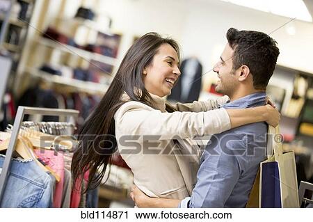 Stock Image - Hispanic couple shopping together. Fotosearch